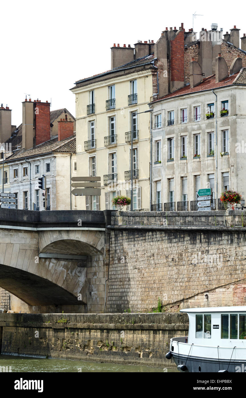 Canal boats docked below the Pont Saint Laurent, Chalon-sur-Saône, Burgundy. France. Stock Photo