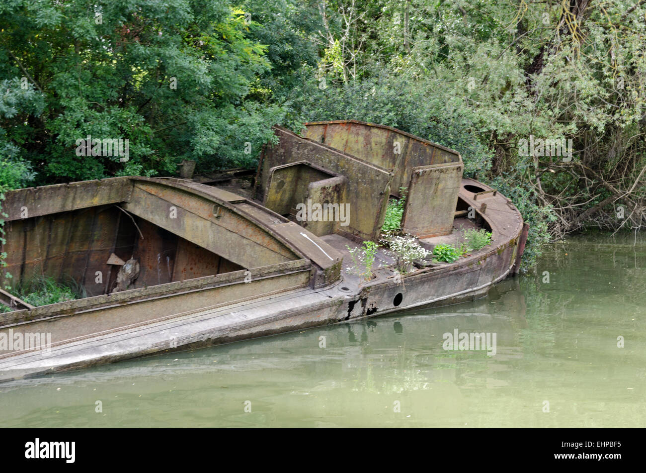 Derelict barge between the Saône River and the Premier Écluse on the Canal du Centre. Stock Photo