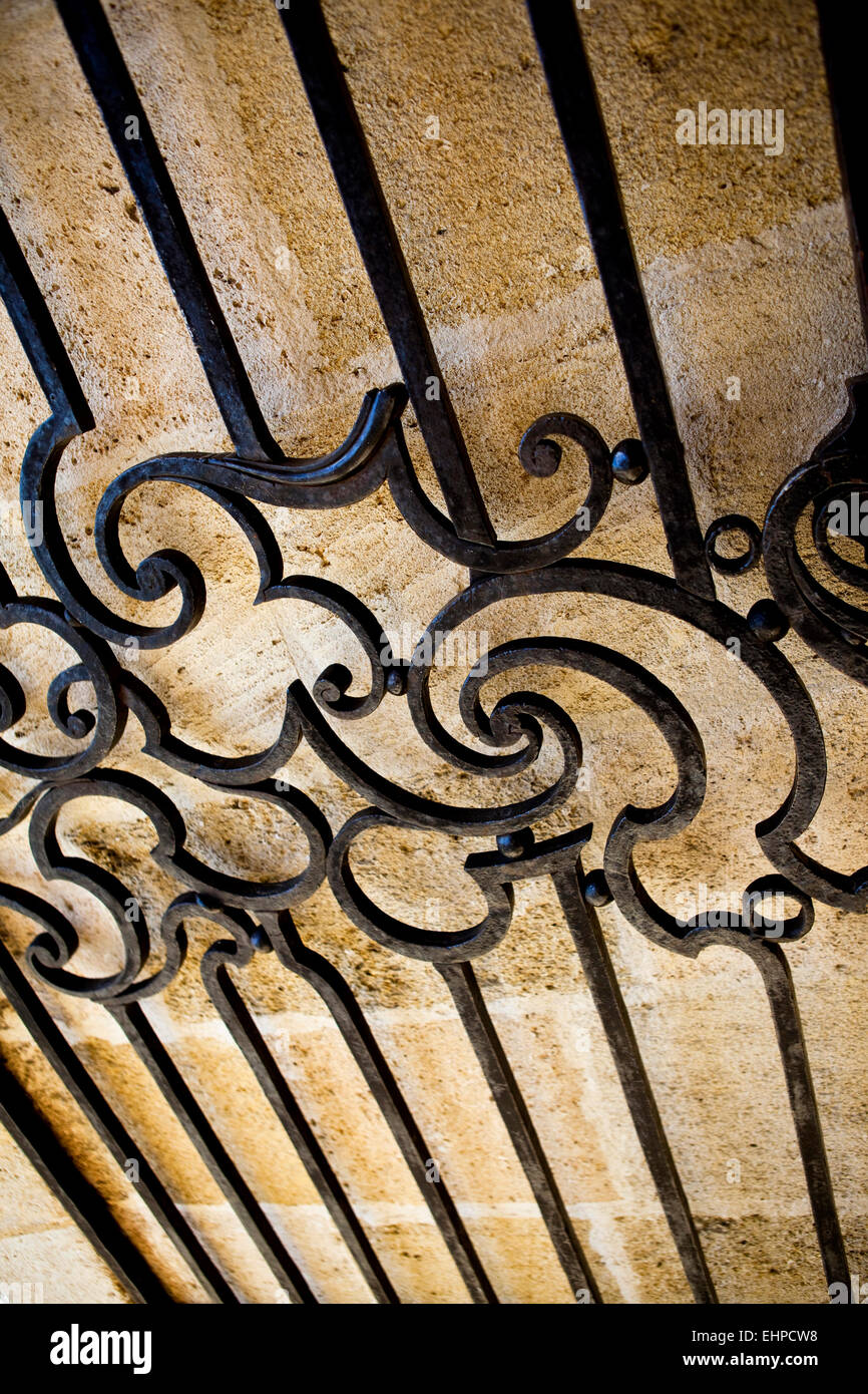 Wrought iron gate of an old French stoned house Stock Photo