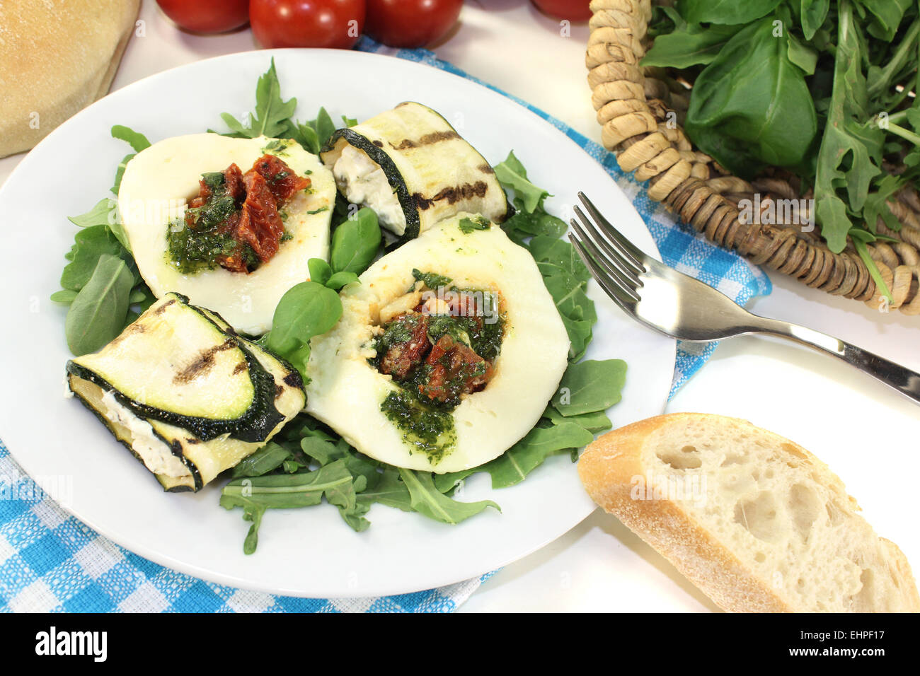 Courgette rolls and filled mozzarella with arugula Stock Photo