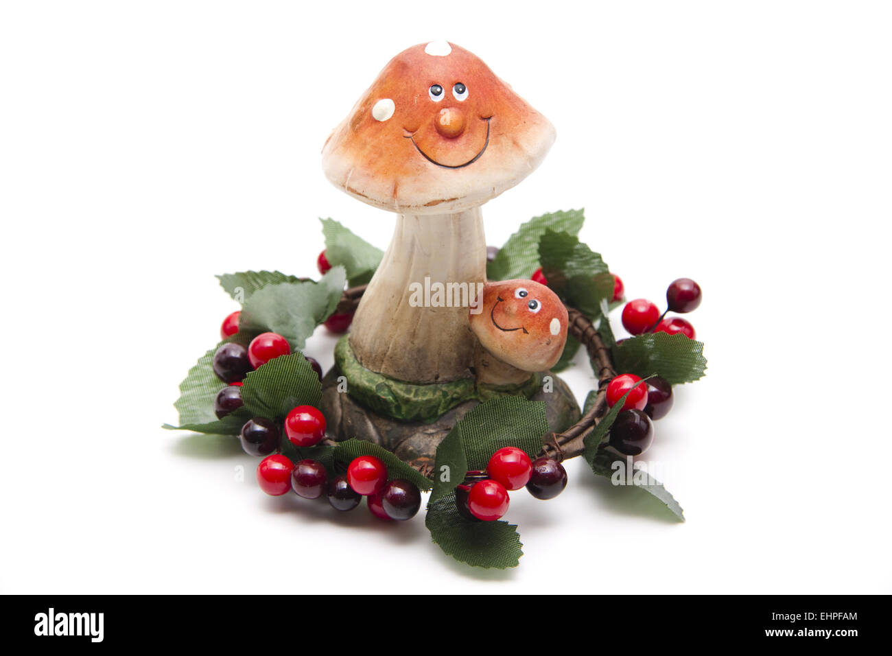 Mushroom figure with berry wreath Stock Photo