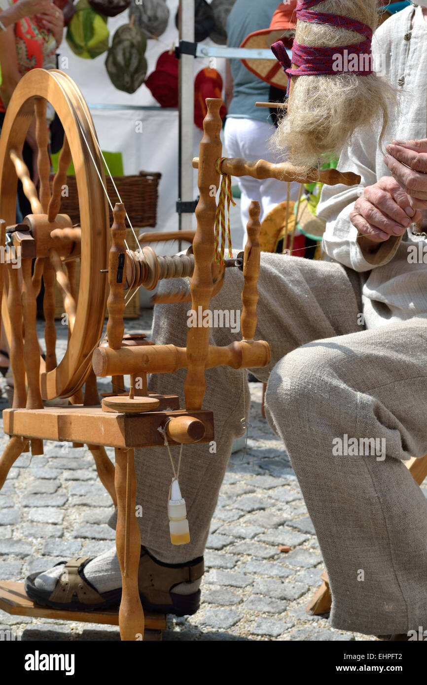 Man on spinning wheel Stock Photo