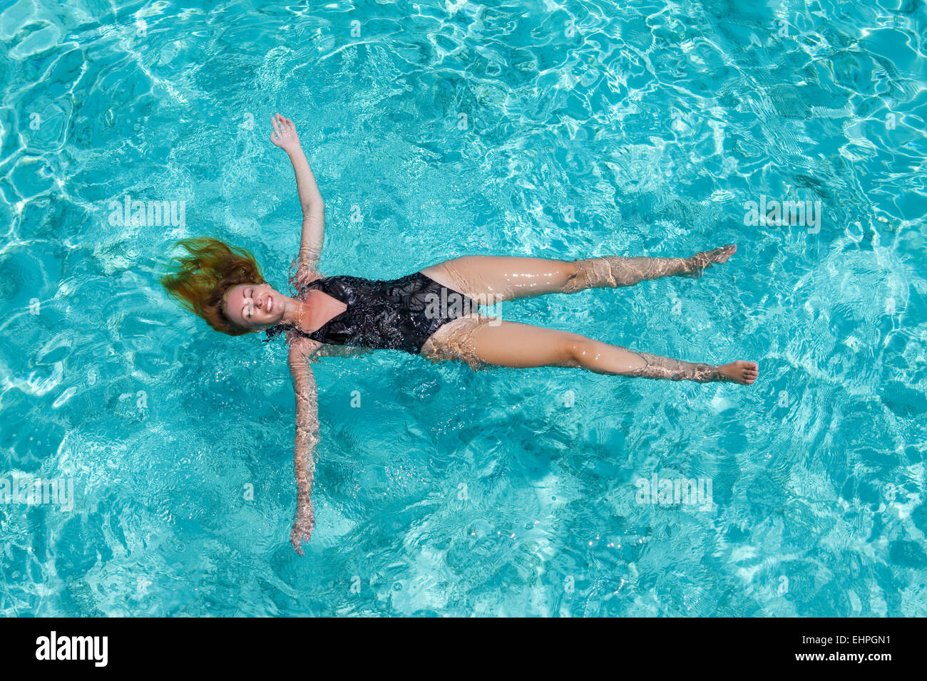 Young woman swiming in sea Stock Photo
