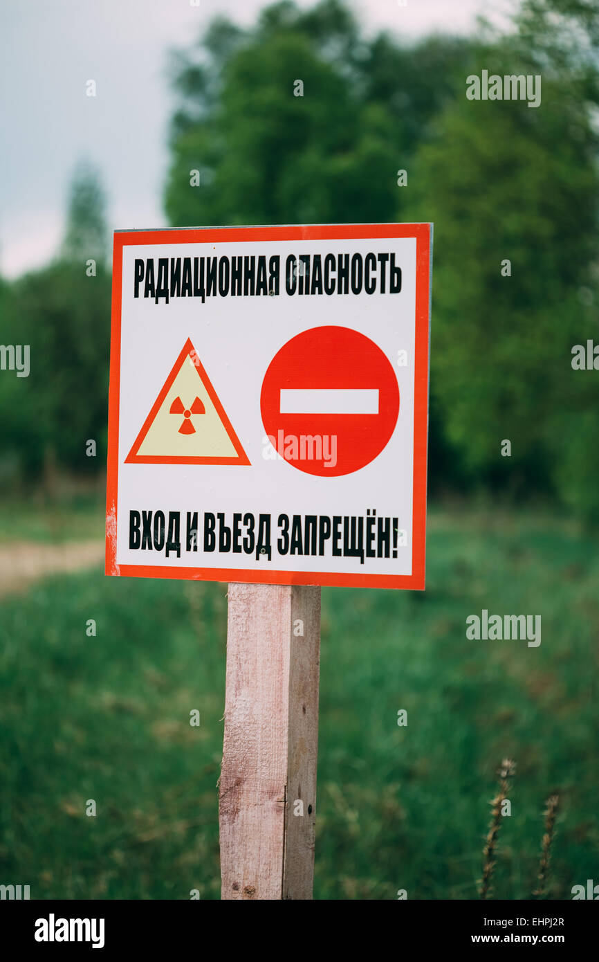 Ionizing Radiation sign next to village Belarus, Gomel region. Zone of Alienation Stock Photo