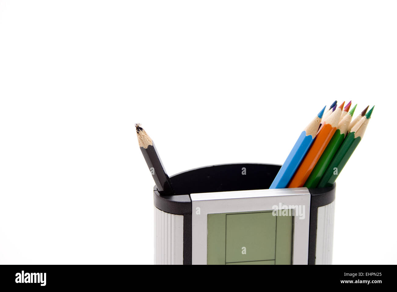 Coloured pencils in pencil holder Stock Photo - Alamy