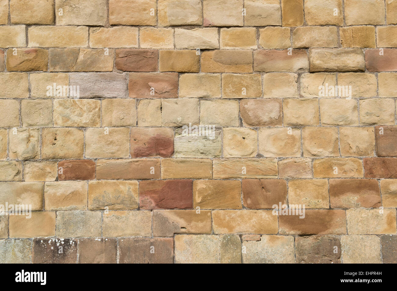Old weathered sandstone block wall. Scotland Stock Photo