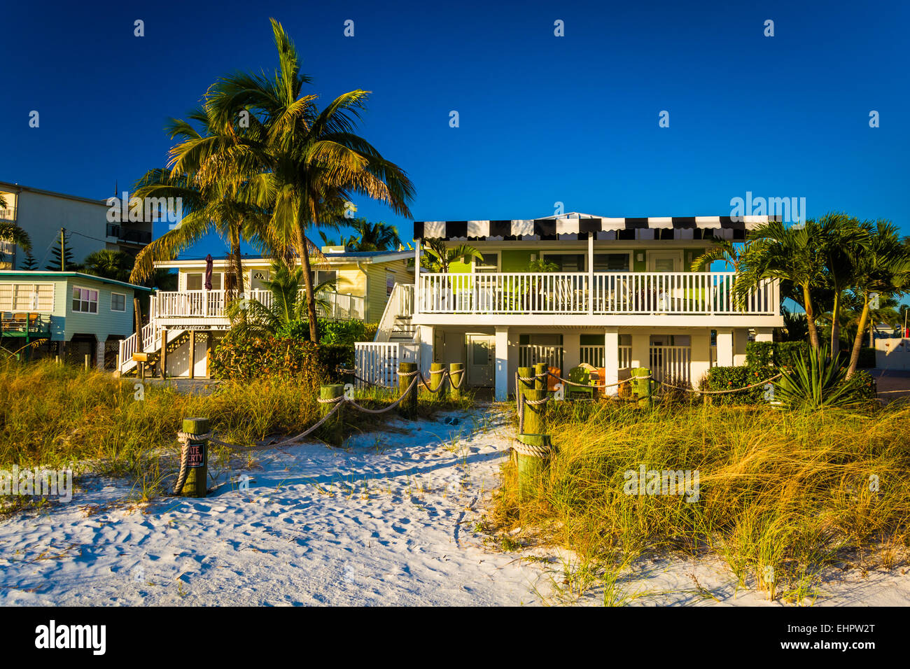 Palm trees and beach houses at Fort Myers Beach, Florida Stock Photo