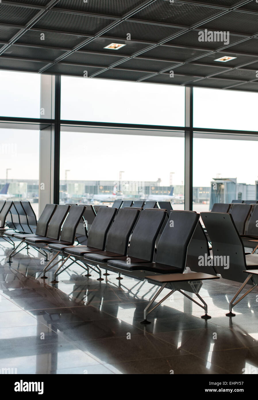 Empty seats in terminal waiting room in airport Stock Photo Alamy