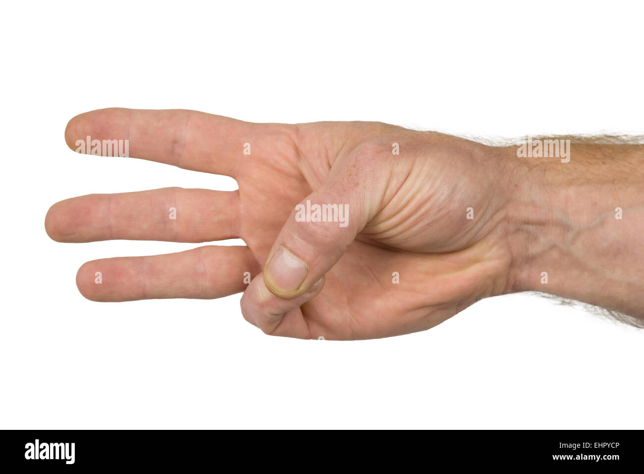 three fingers of a hand show a sign Stock Photo