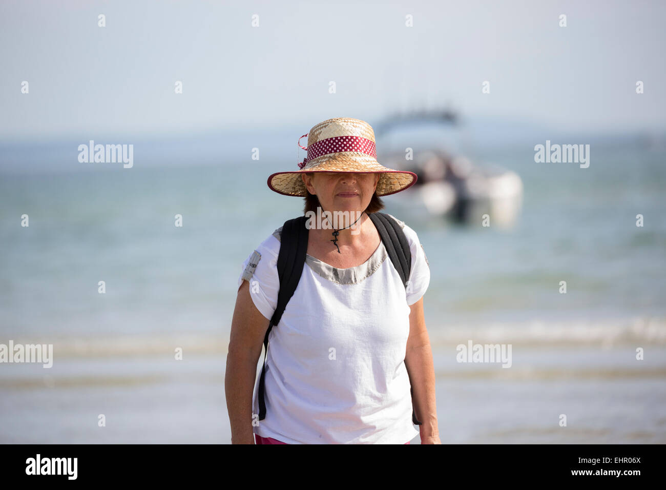Adult woman standing in water. Stock Photo