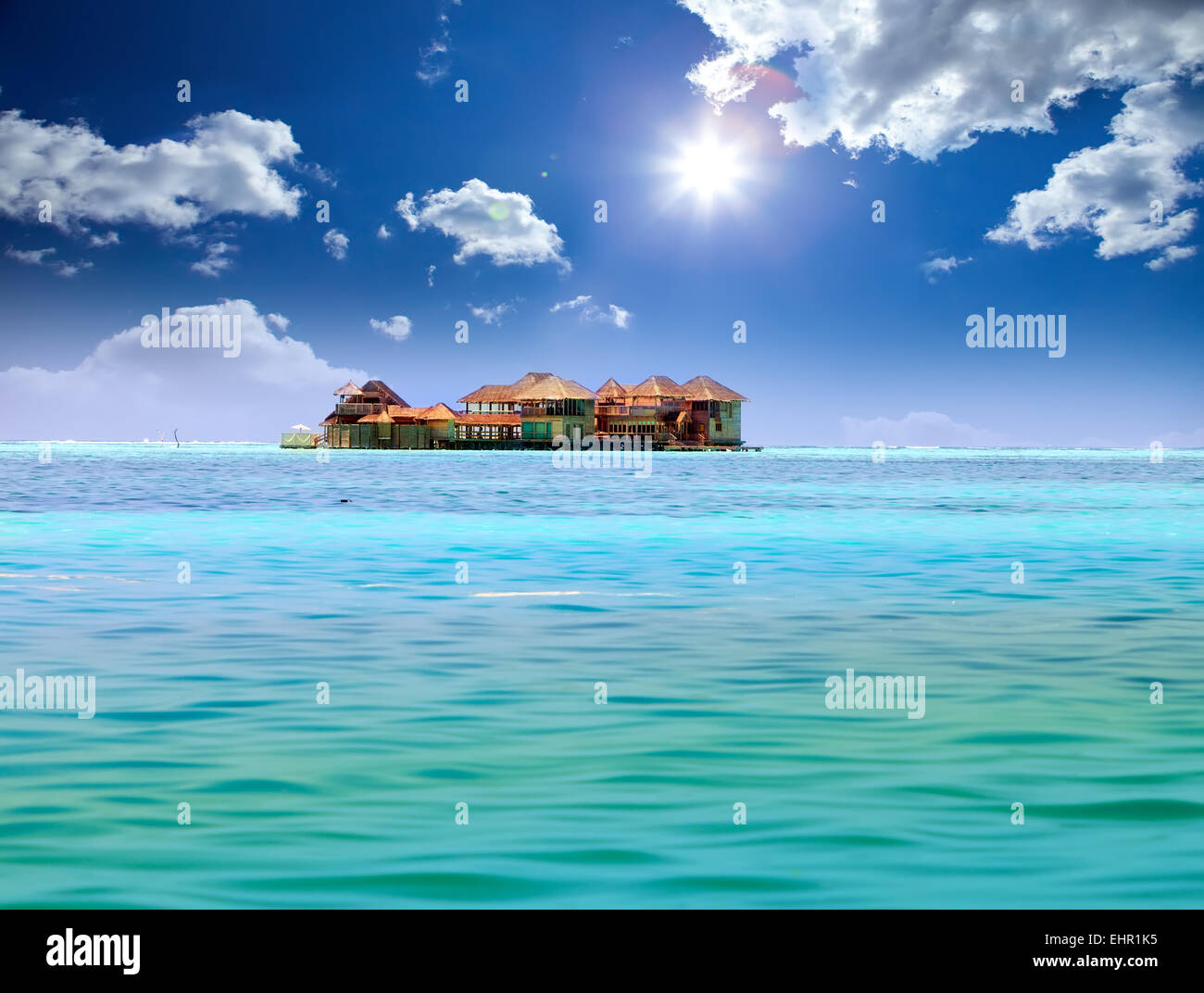 Island in ocean, overwater villas Stock Photo