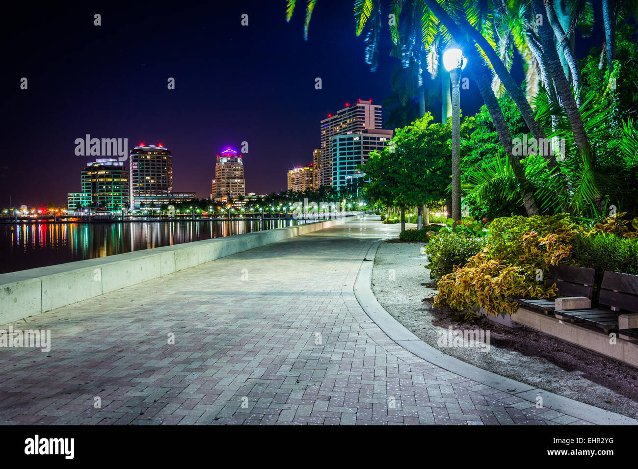 Waterfront promenade and the skyline at night in West Palm Beach, Florida. Stock Photo