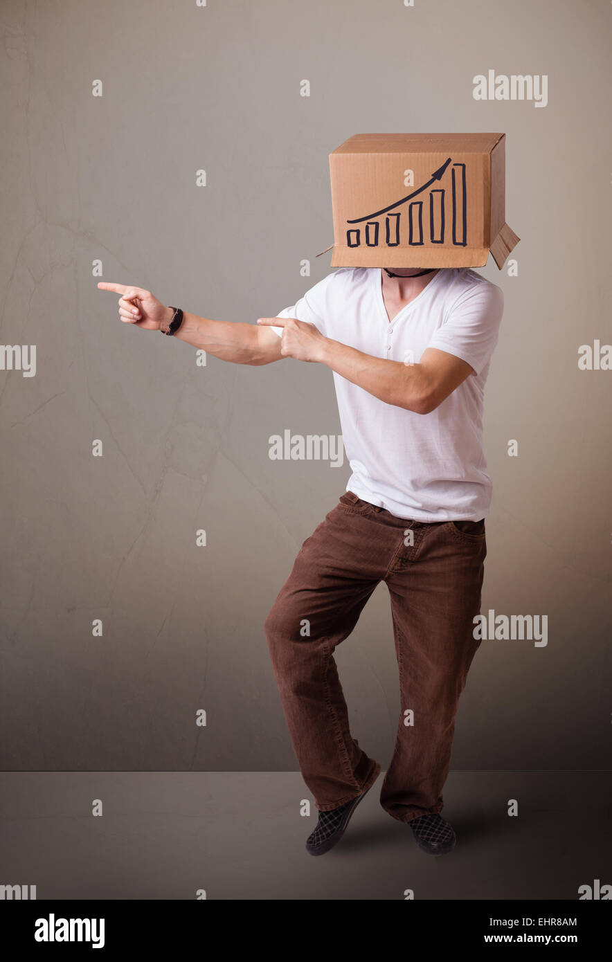 Young man gesturing with a cardboard box on his head with diagram Stock ...