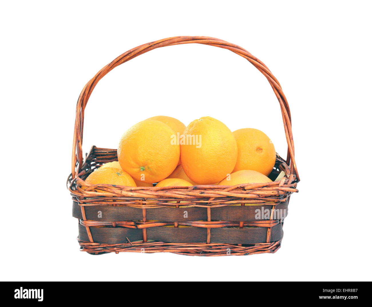oranges in trellis basket isolated over white background Stock Photo