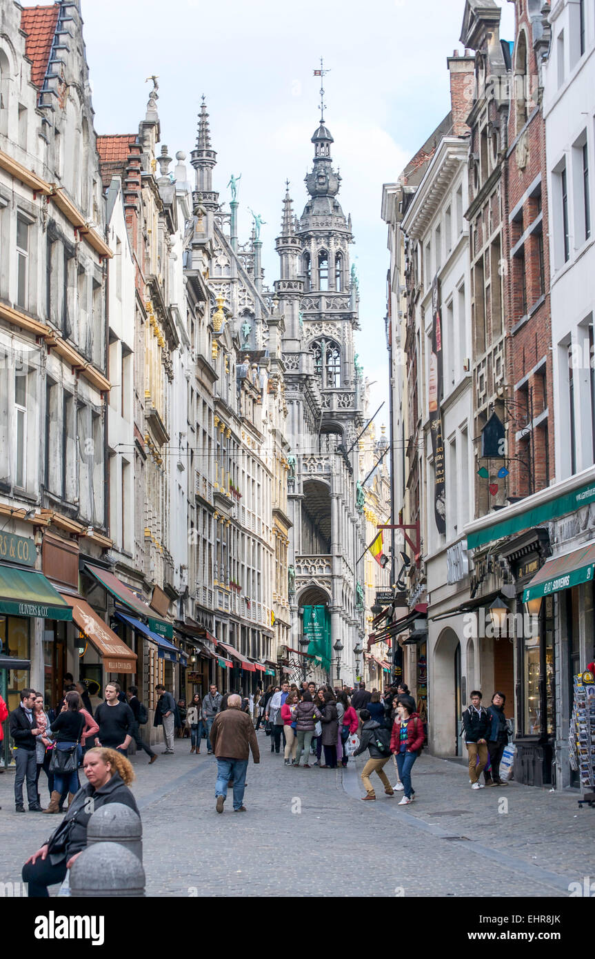 People strolling down a busy street leading to the historic Grand Place in Brussels, Belgium. Stock Photo