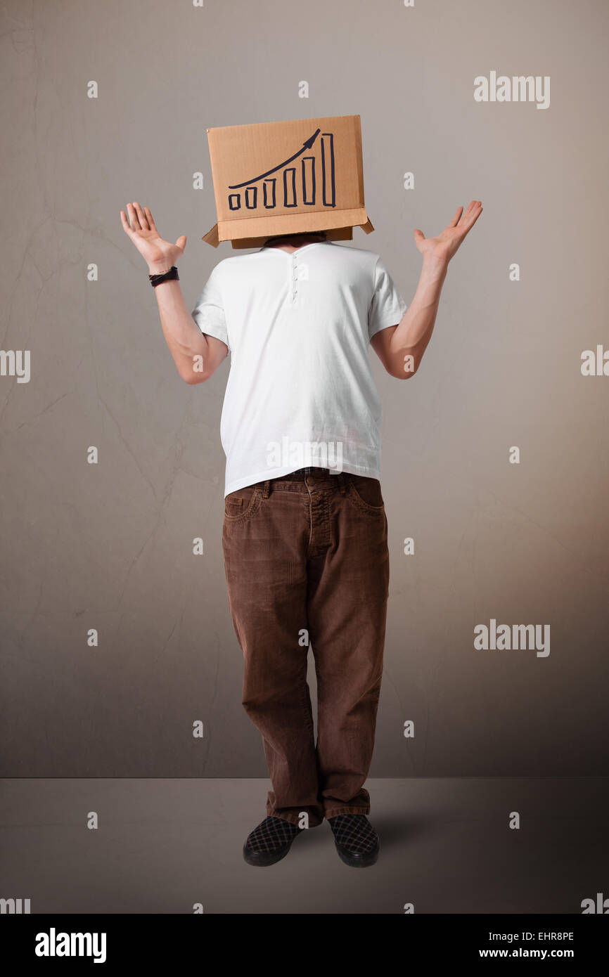 Young man gesturing with a cardboard box on his head with diagram Stock ...