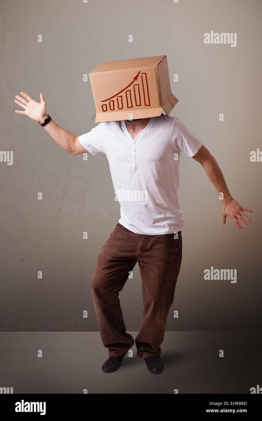 Young man gesturing with a cardboard box on his head with diagram Stock ...