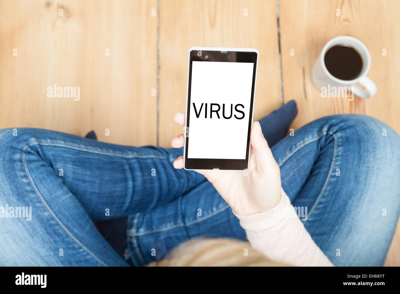 virus written on smartphone Stock Photo