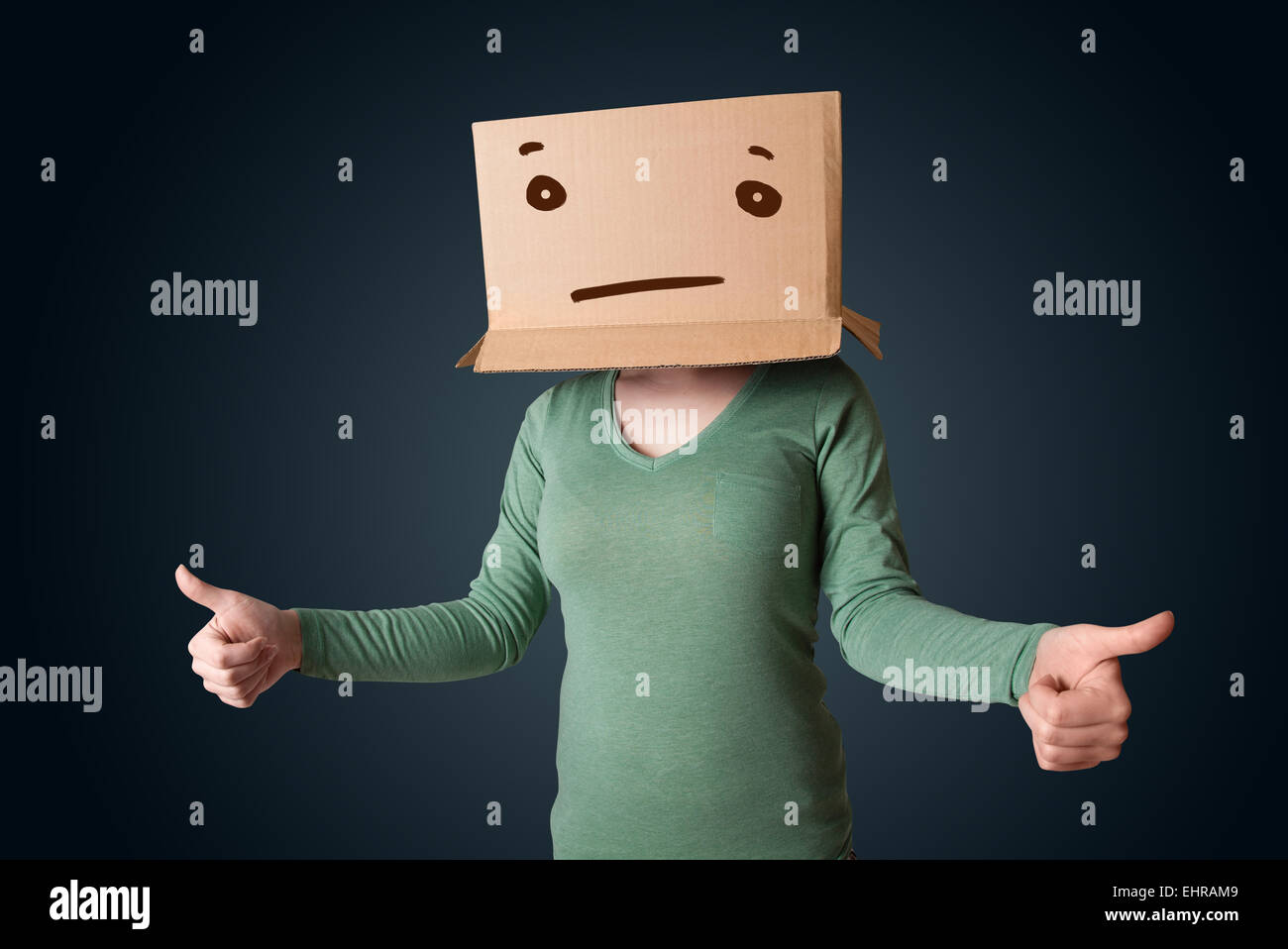 Young girl gesturing with a cardboard box on her head with straight