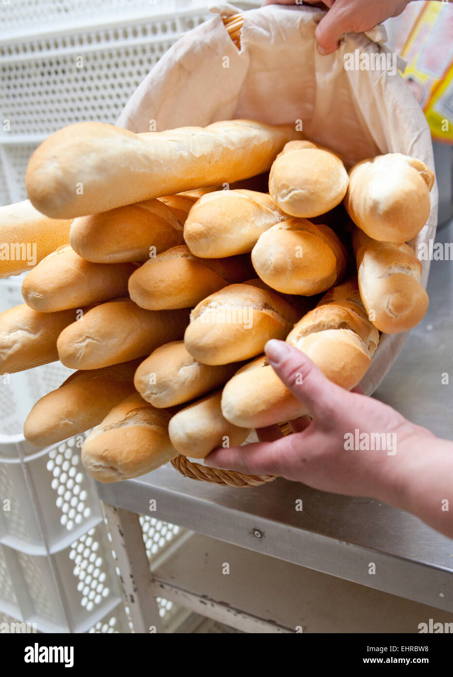 Baguette basket of bread loaves at bakery Stock Photo