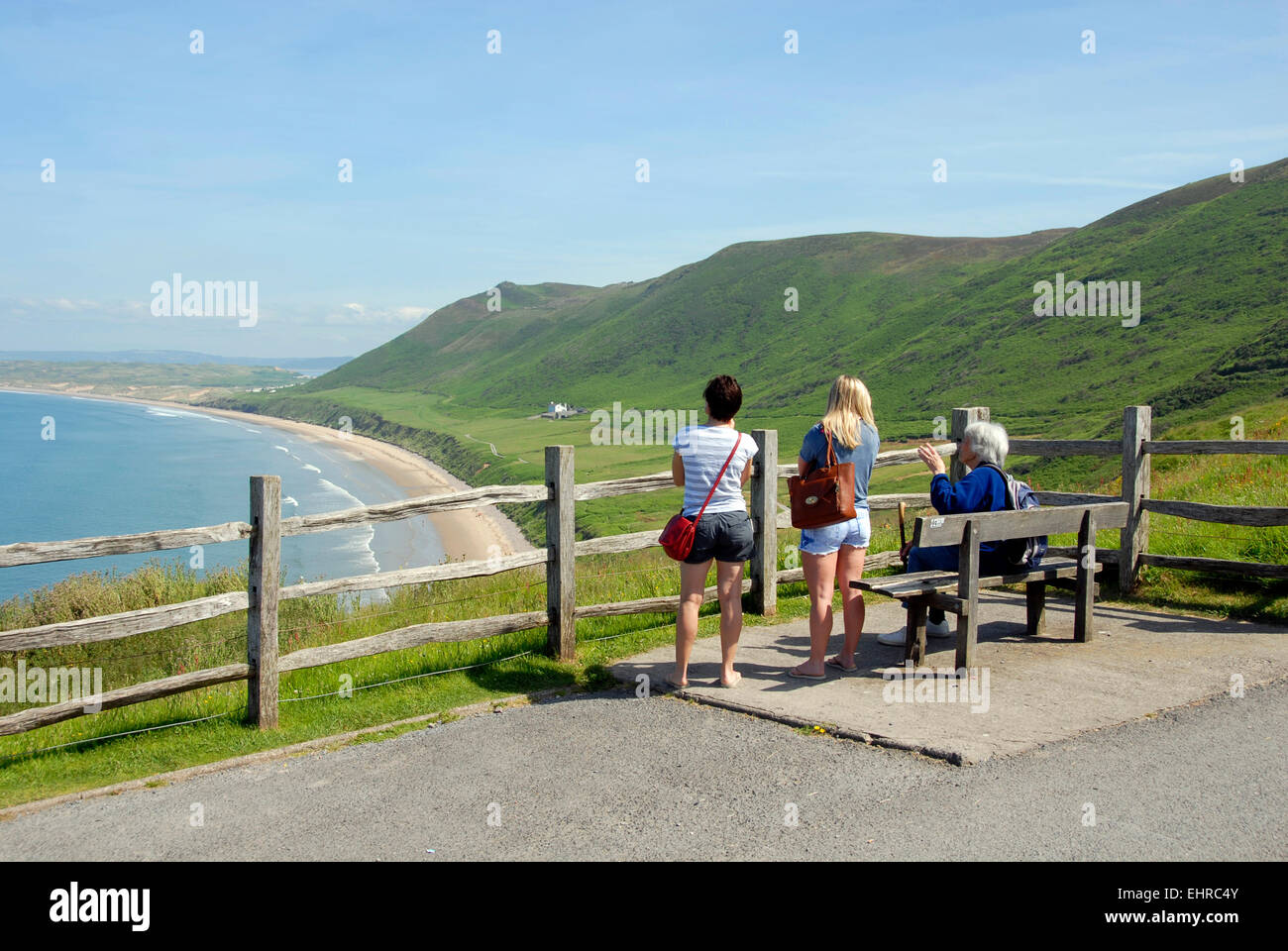 Group of people overlooking the beach and bay, Rhossili, Gower, South Wales Stock Photo