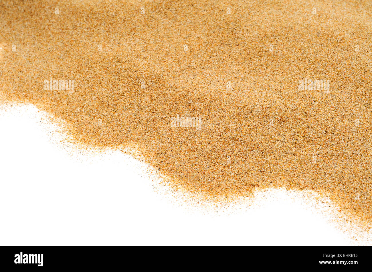 closeup of a pile of sand of a beach or a desert, on a white background ...
