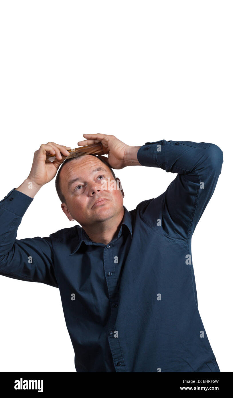 Guy with little hair left to be combed Stock Photo