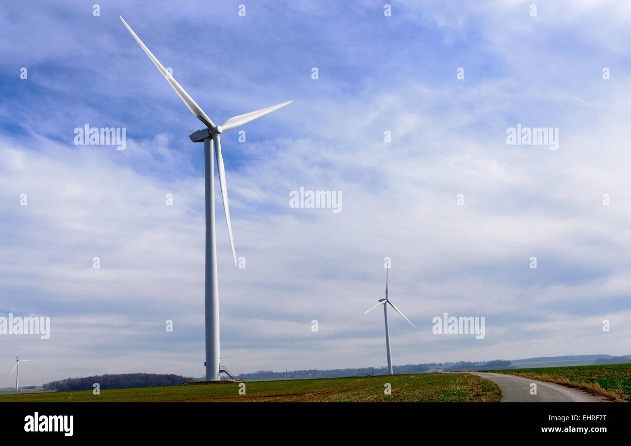 wind turbine on a blue sky with a few clouds Stock Photo - Alamy