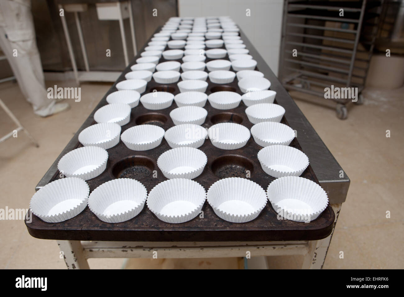 Baking cups tray. Handmade manufacturing process of spanish madeleines