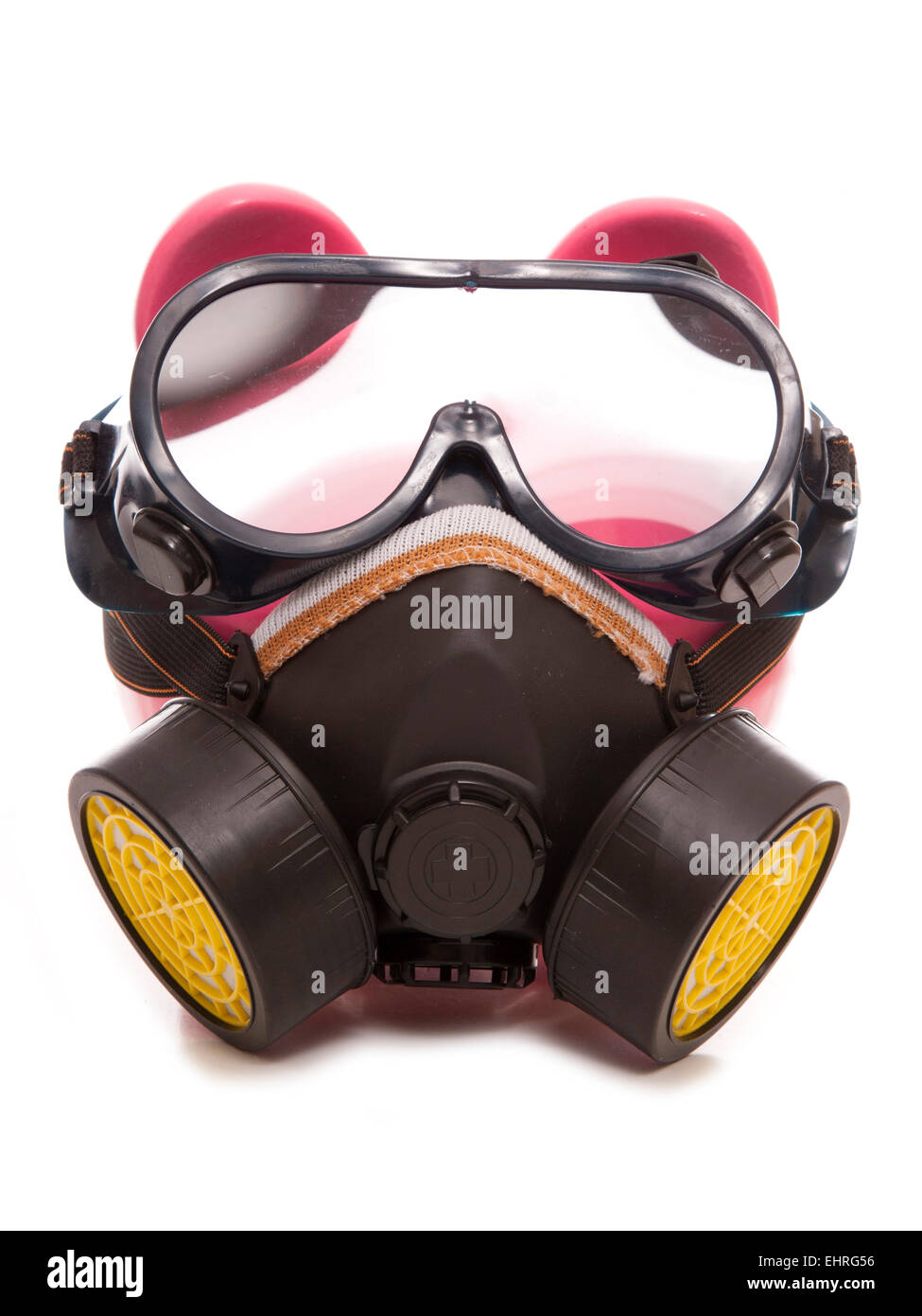 piggy bank wearing industrial gas mask cutout Stock Photo