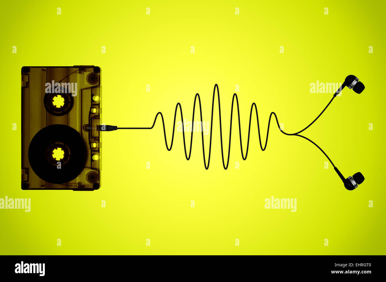 A cassette tape on a lime background with tape coming out of the