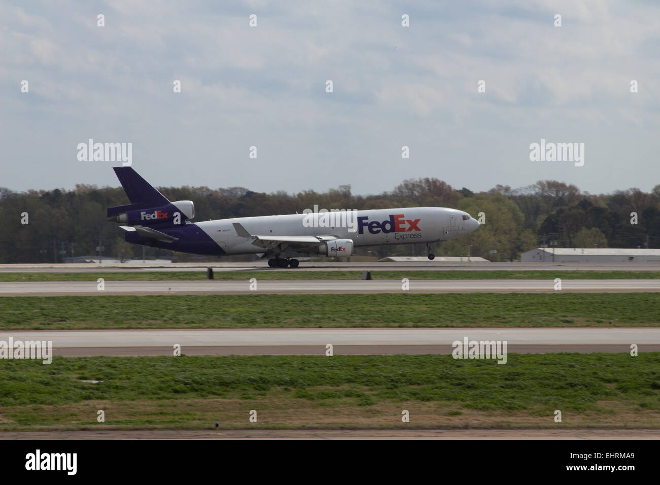FedEx express plane taking off the runway from  Memphis International Airport, Tennessee USA Stock Photo