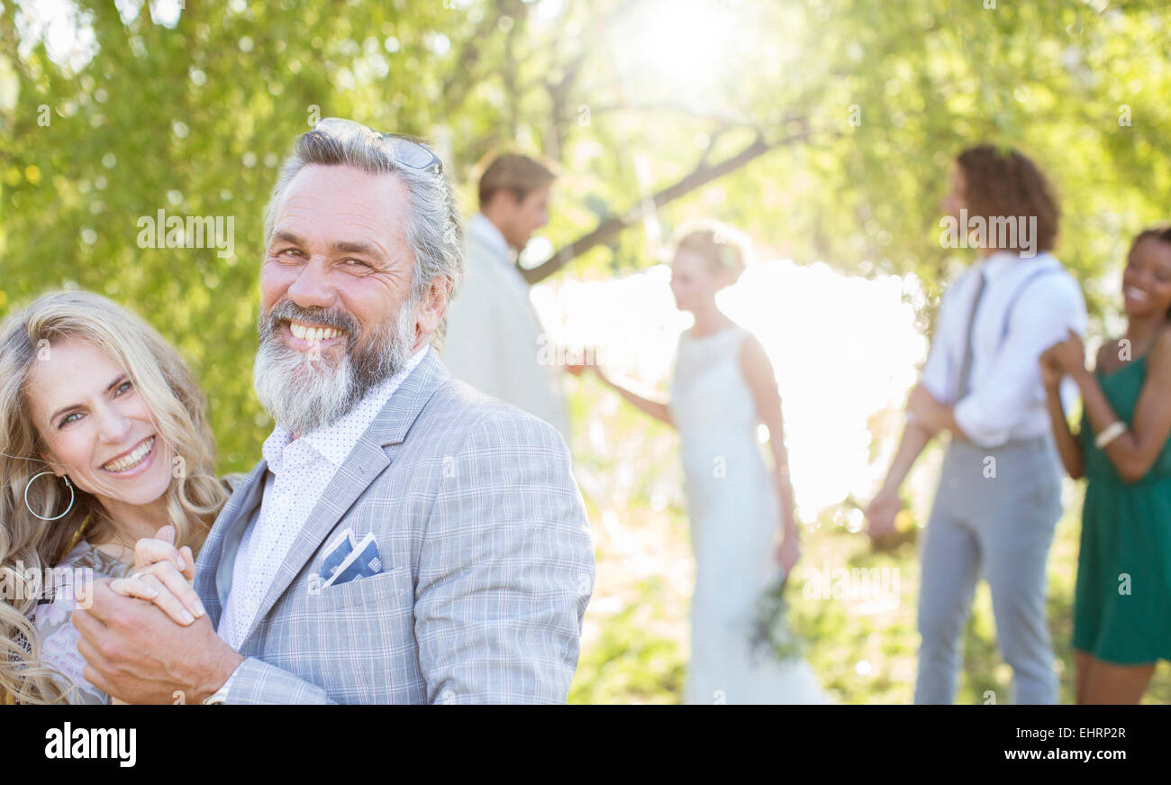 Matron of honor dancing with best man during wedding reception in ...