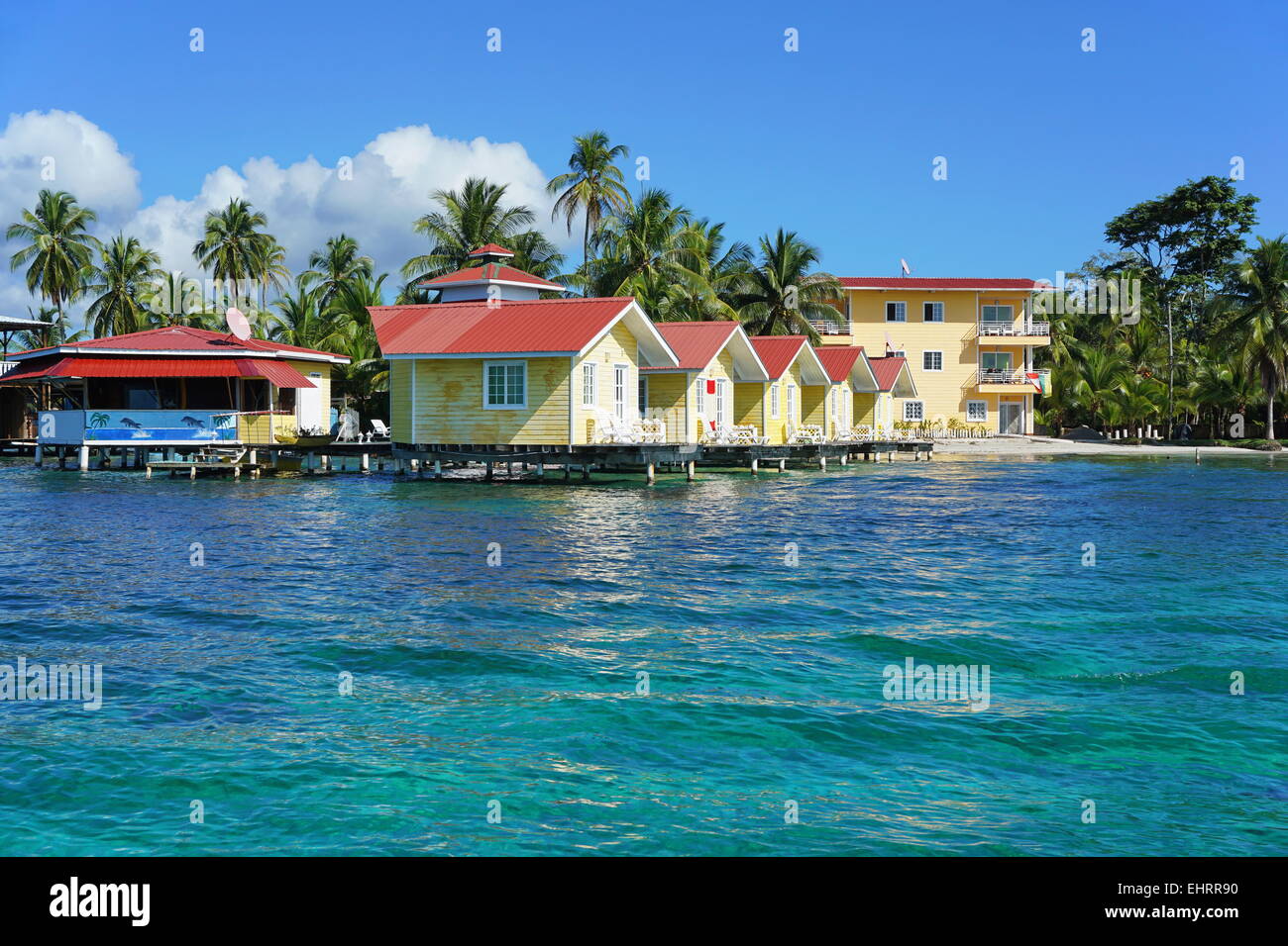 Tropical resort with cabin over water of the Caribbean sea, Carenero island, Bocas del toro, Panama, Central America Stock Photo
