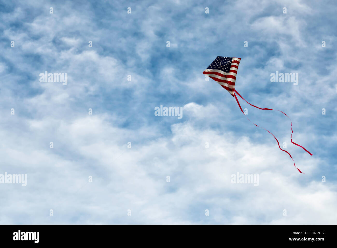 American Flag kite under a beautiful cloudscape Stock Photo - Alamy