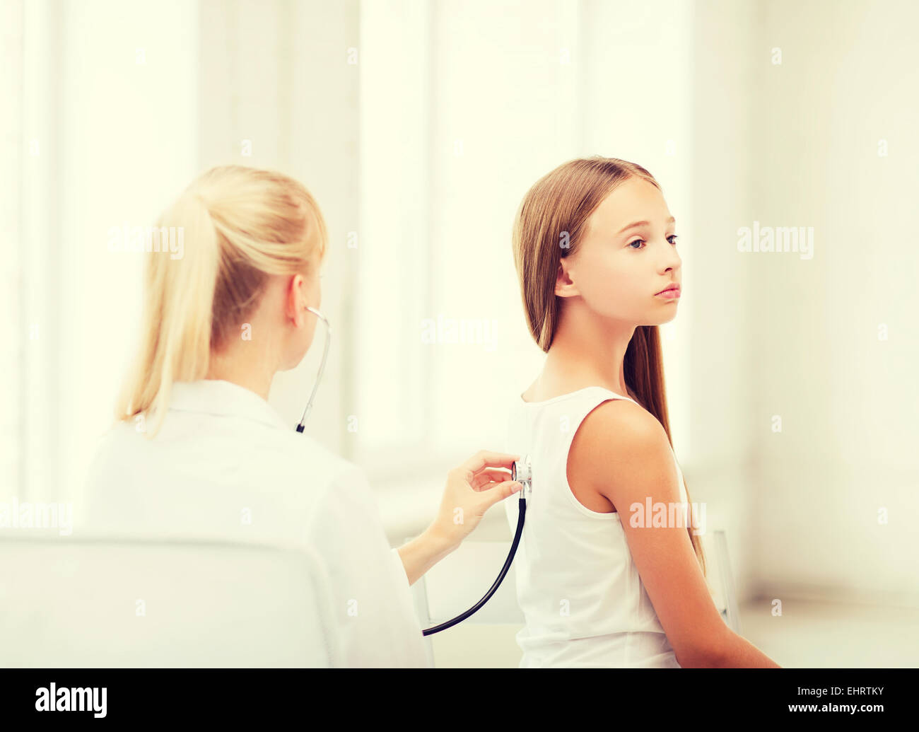 doctor with stethoscope listening to the patient Stock Photo - Alamy