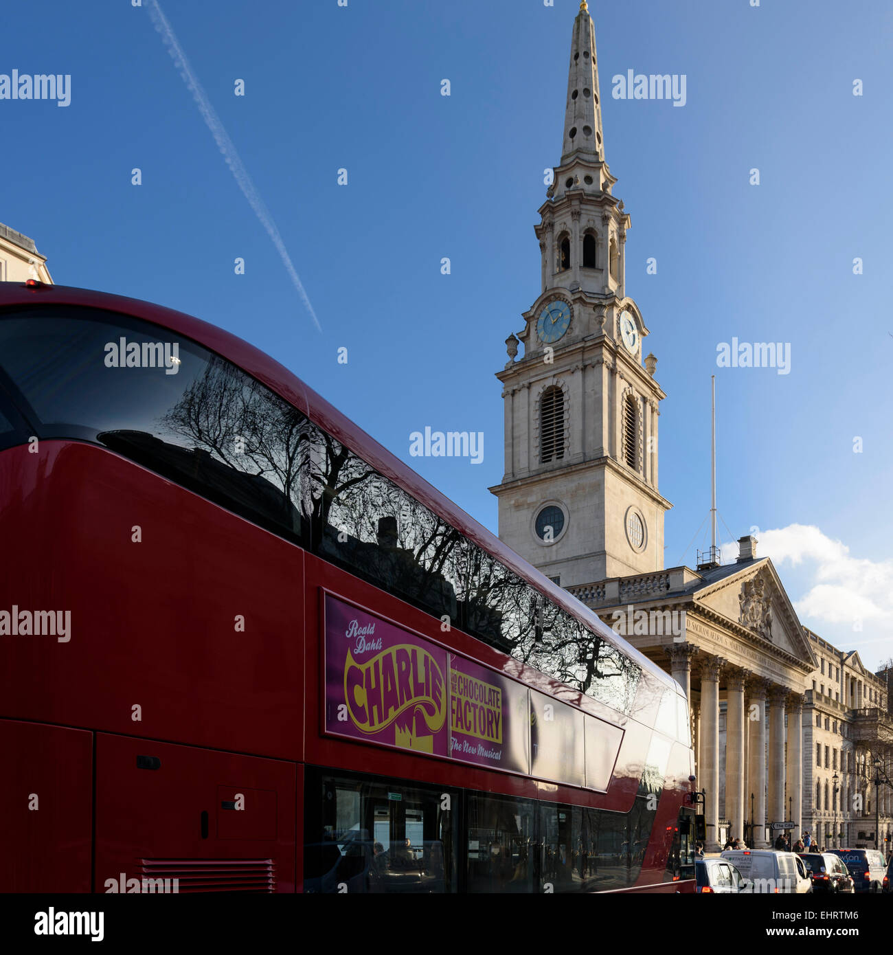 New London red double decker bus passing by St Martin-in-th-Field church near Trafalgar Square. Stock Photo