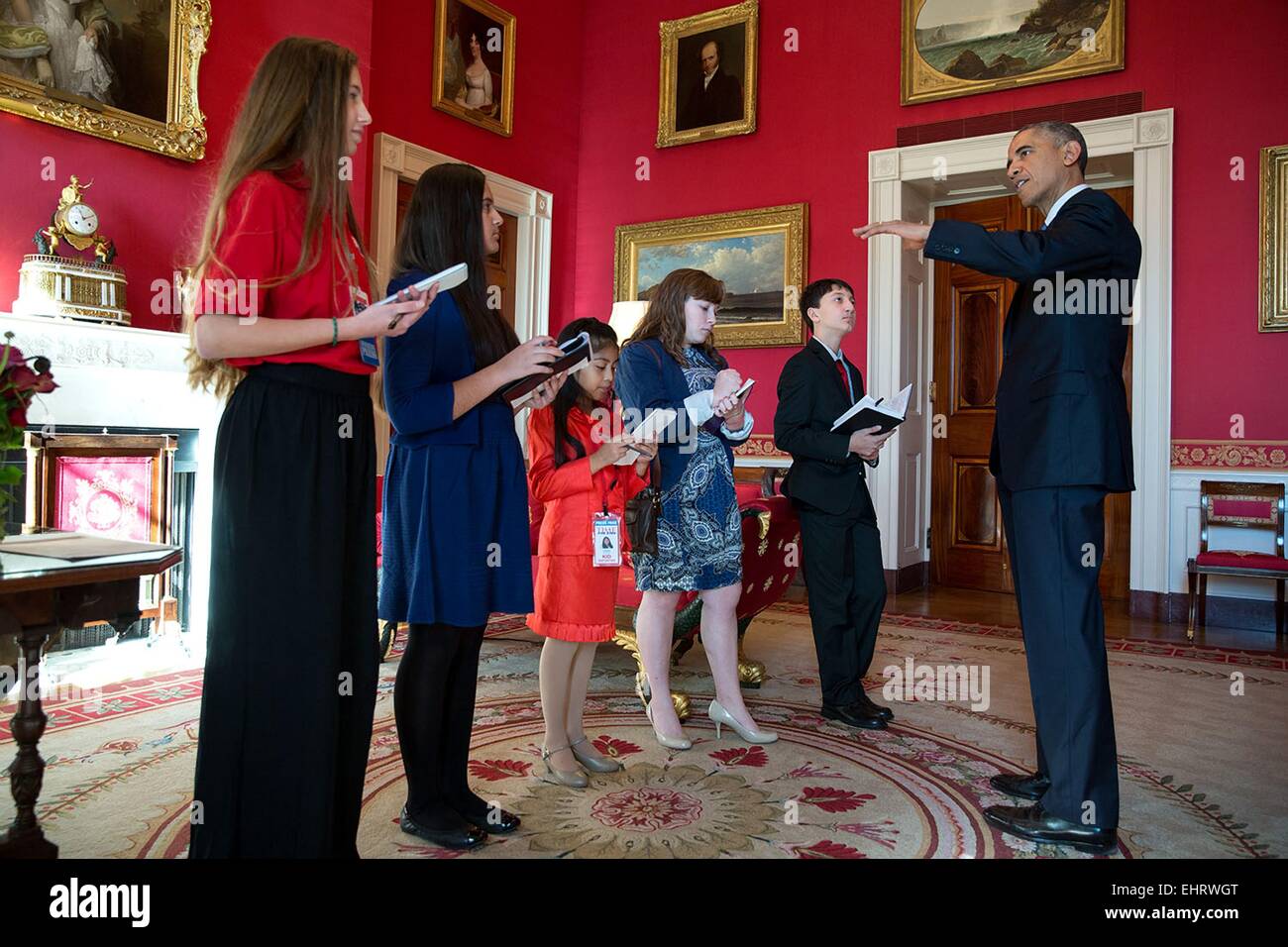 US President Barack Obama meets with student reporters in the Red Room of the White House prior to hosting the 'ConnectED to the Future' conference with superintendents and other educators from across the country who are leading their schools and districts in the transition to digital learning November 19, 2014 in Washington, DC.. Students, from left, Ainsley Felter, Scholastic News Kids Press Corp (age 13), Julie Vadhan, Huffington Post Teen (age 14), Liliana Scott, Time For Kids (age 8), Tess Harkin, Student Voice (age 17) and Sam Parekh, Kids Scoop Media (age 13). Stock Photo