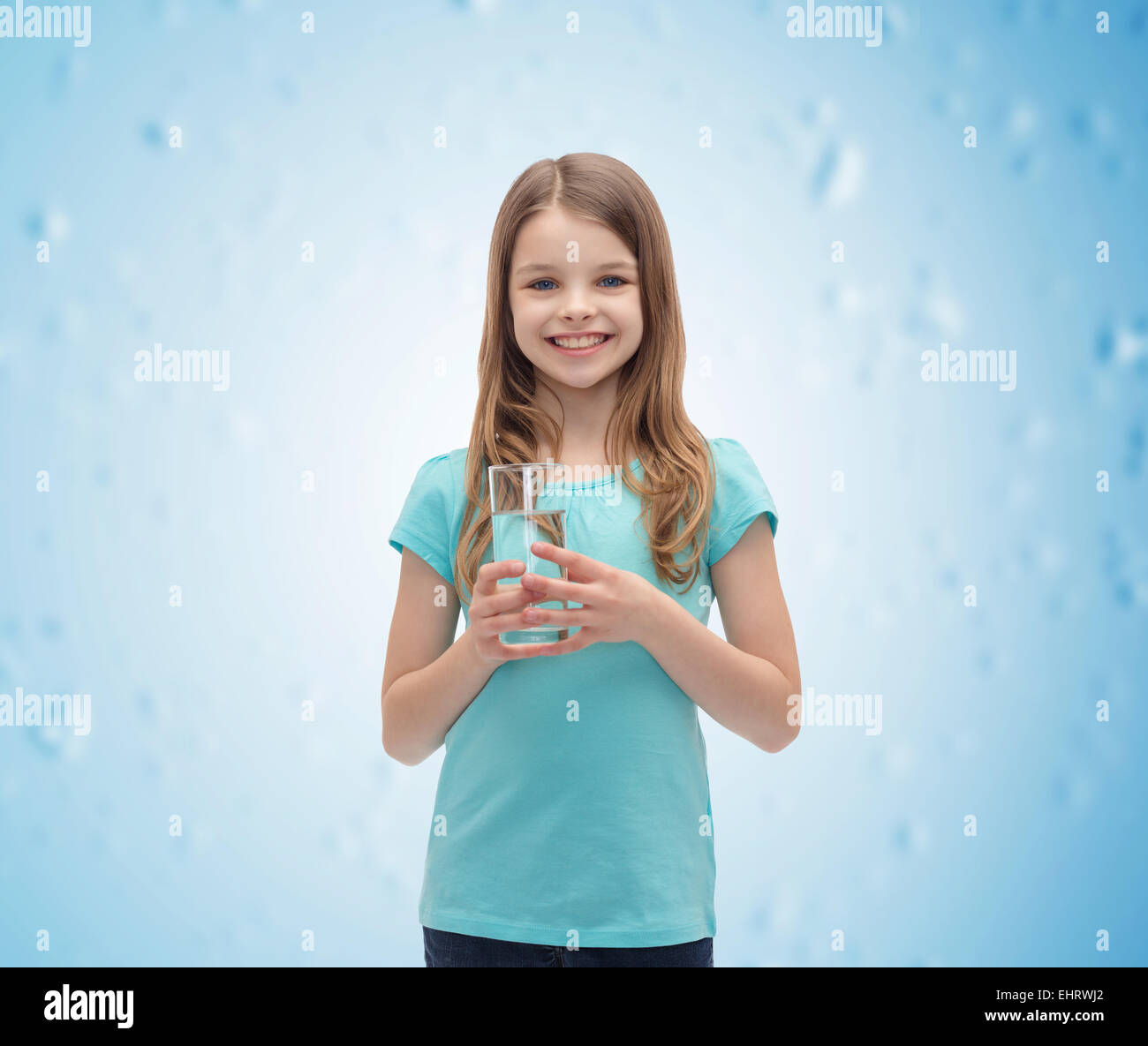 smiling little girl with glass of water Stock Photo - Alamy