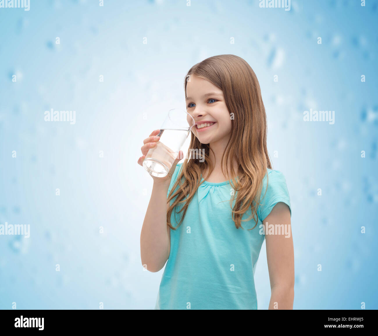 smiling little girl with glass of water Stock Photo - Alamy