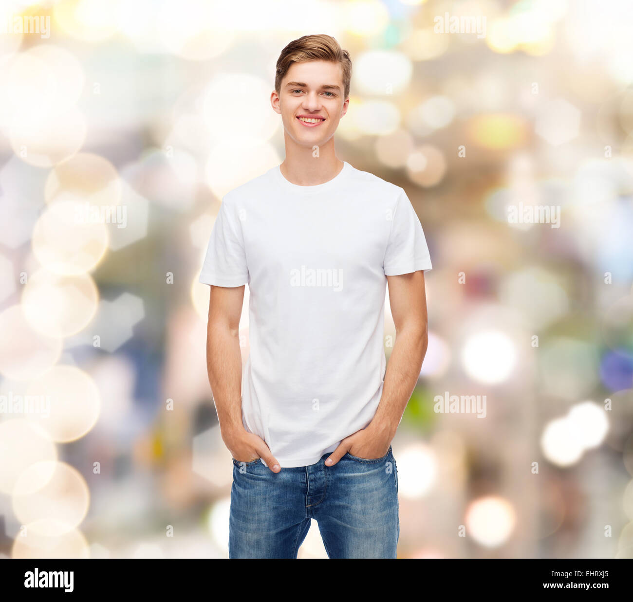 smiling young man in blank white t-shirt Stock Photo