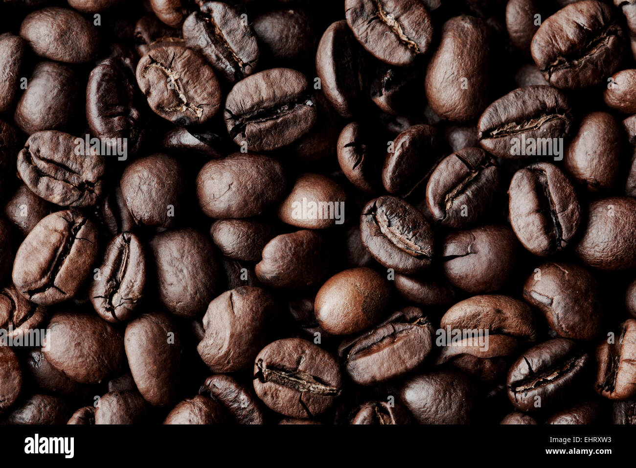 Roasted Coffee beans dark background macro close-up Stock Photo - Alamy