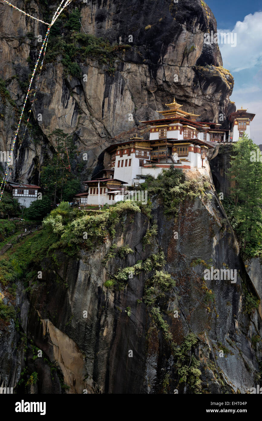 BHUTAN - Taktshang Goemba, (the Tiger's Nest Monastery), perched on the side of a cliff high above the Paro River Valley. Stock Photo
