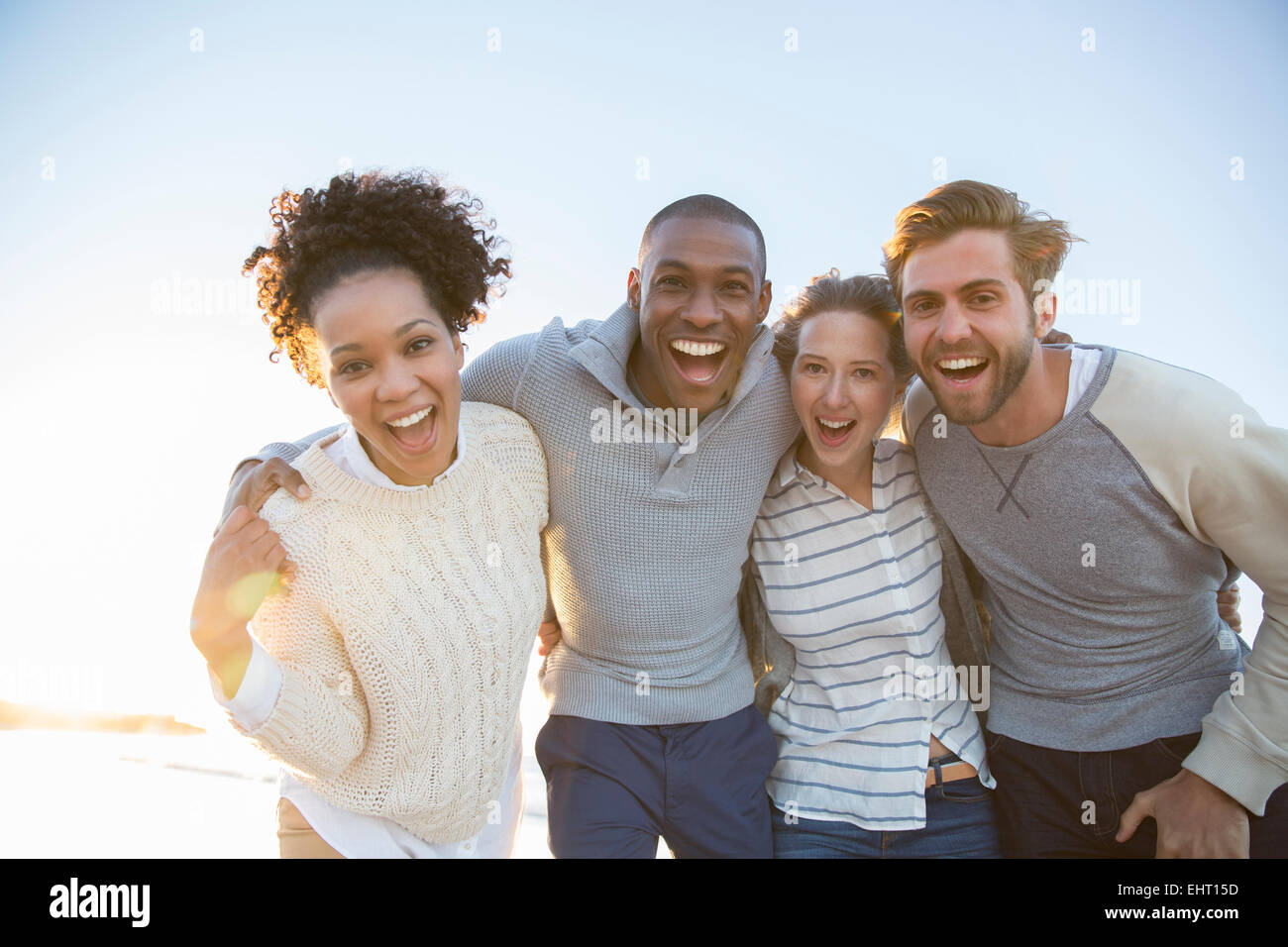 Portrait of cheerful friends in sunlight Stock Photo