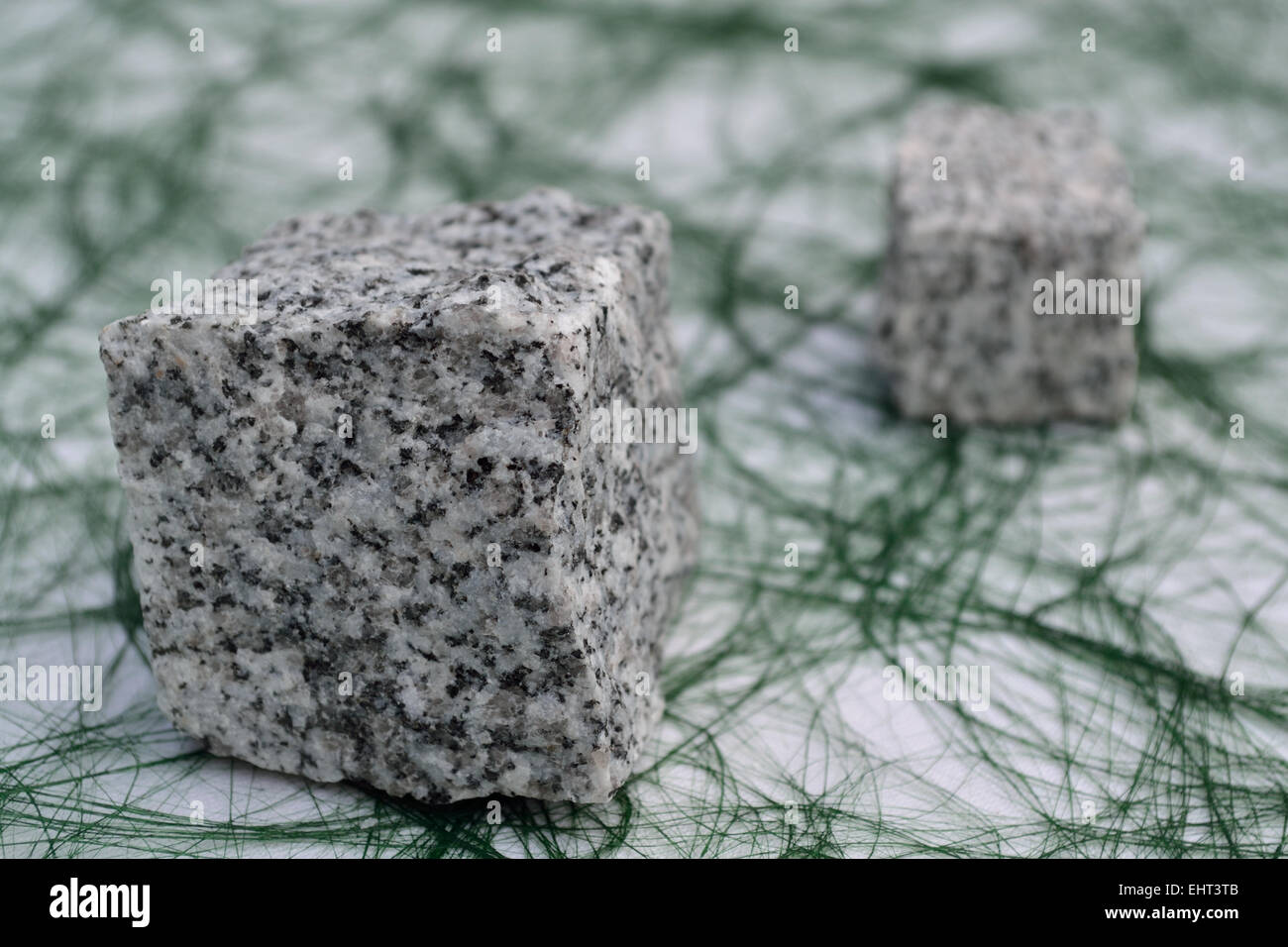 Natural stones on a green tablecloth Stock Photo