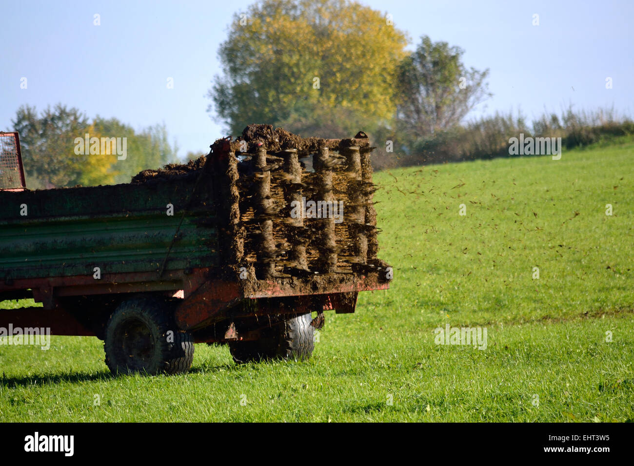 Compost manure spreader brings out Stock Photo