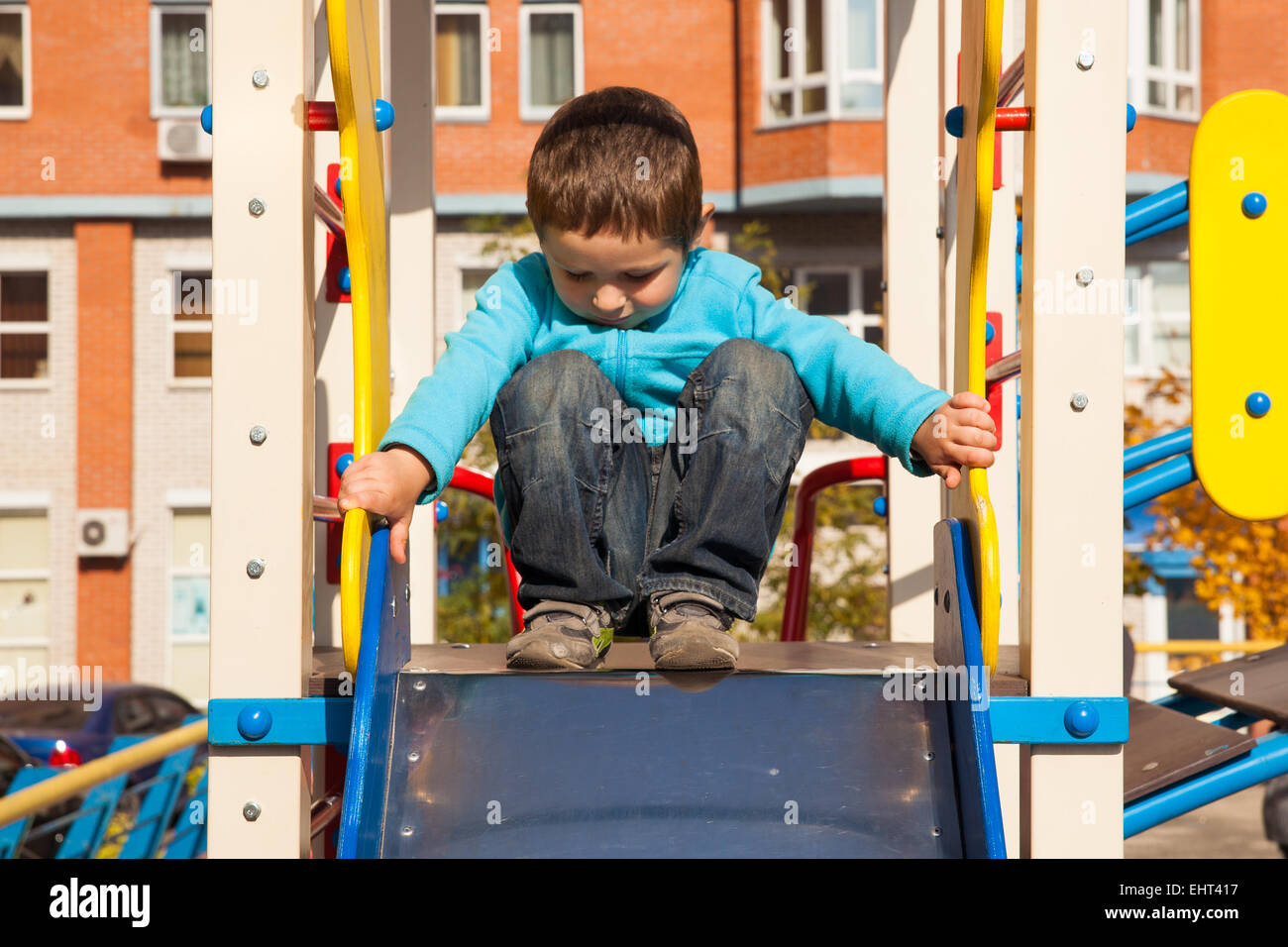Little boy having fun on playground Stock Photo