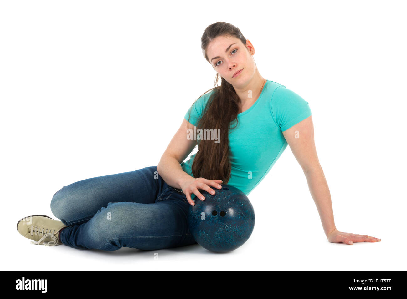 Beautiful woman sitting with a bowling ball, isolated on white background Stock Photo