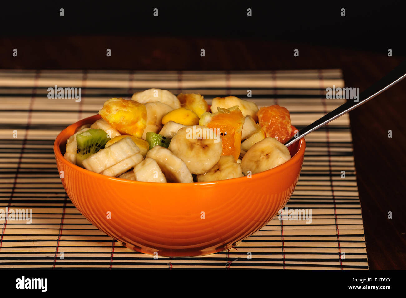 Mixed fruit salad, orange bowl, fresh healthy diet Stock Photo