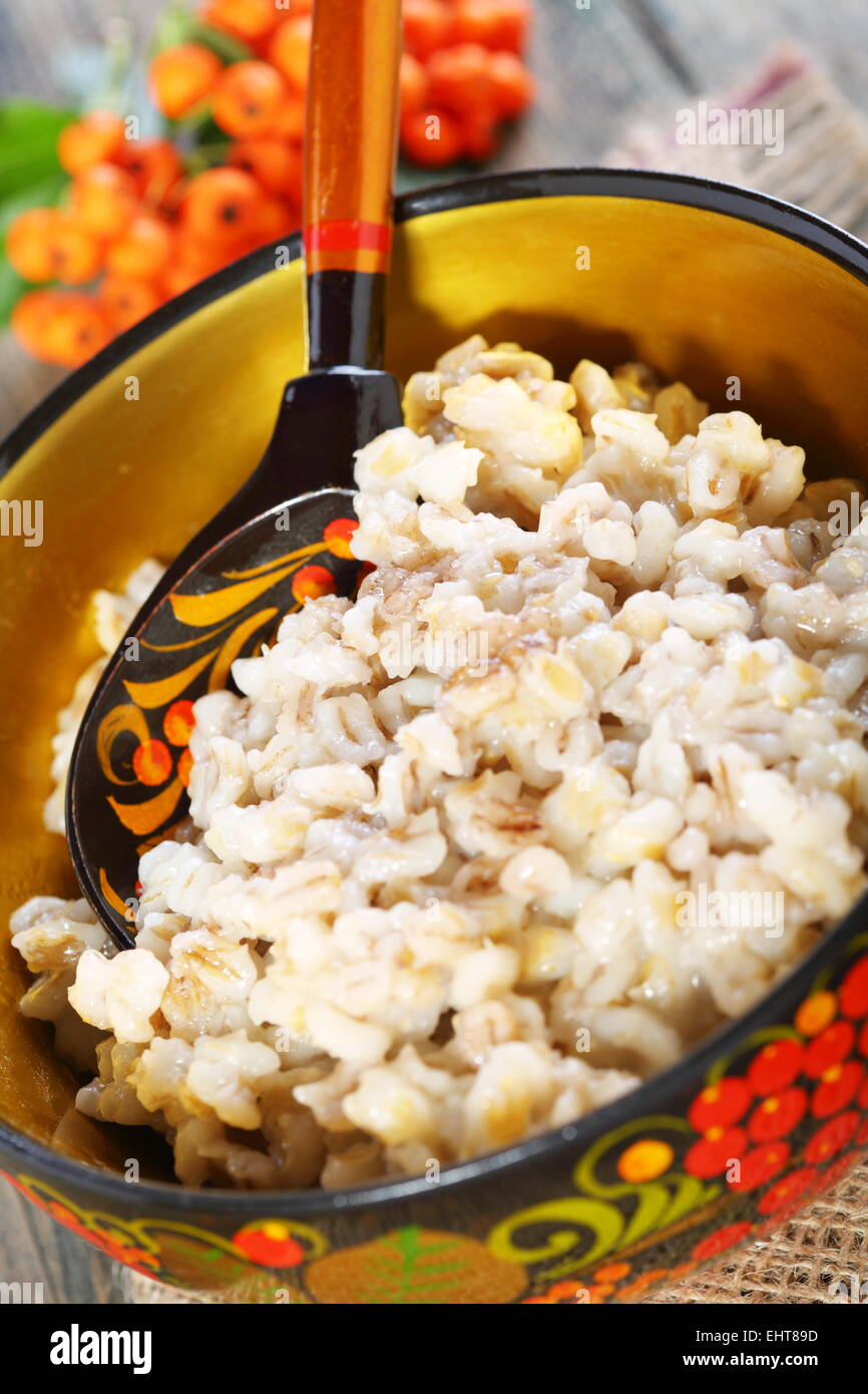 Pearl barley porridge in bowl. Stock Photo